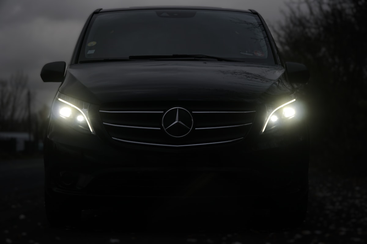 Black Mercedes Sprinter van for group transportation
